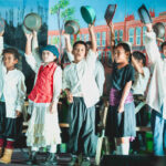 The chorus of children holding up their food bowls in the play Oliver! The play opened March 4 and runs through March 9 at the International Conference Center in Majuro. Photo: Chewy Lin.