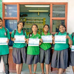 Chewy Lin, left, and Wilmer Joel, right, with the LSA student graduates who helped with the film project. Photo: Chewy Lin.