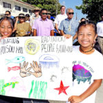Lirok Kelen (left) and Mymy Loeak led the Nuclear Victims Remembrance Day march on March 1 in Majuro. The March, from the Alele Museum to the College of the Marshall Islands, involved several hundred people including VIPs behind Lirok and Mymy Foreign Minister Kalani Kaneko, US Embassy Chargé and Pacific Islands Forum Secretary General Henry Puna.