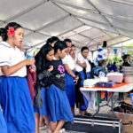 CMI staff Camilla Betwell, right, speaks to Assumption High School students about the role of auxiliary and commercial services at CMI. Photo: Wilmer Joel.