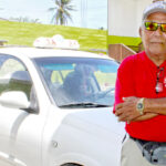 Majuro Atoll Taxi Drivers Association President Anej Ishiguro is pictured with his taxi. Photo: Hilary Hosia.