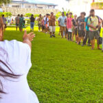 Associate Dean of Equity and Engagement Meyar Margaret Laukon, at left, arranges the CMI student lineup during a practice session for the college’s May 30 graduation ceremony. Photo: Wilmer Joel.