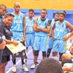 During a timeout in play at the Micronesian Games in Majuro, Head Coach Jubilee Kuartei maps a play for the Palau men’s national team. Photo: Hilary Hosia.