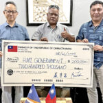 Taiwan Ambassador Steve C.C. Hsia presents a check for climate-related activity to Minister in Assistance Bremity Lakjohn and Foreign Minister Kalani Kaneko.