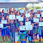 Youthful students in the Tulam Turi STEAM summer camp show off their certificates of completion at the closing program. Photo: Wilmer Joel.