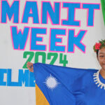 Assumption Schools student Kiola Kios showed off her appreciation for Marshall Islands culture by donning a flag dress, flower head lei, and Marshallese woven earrings and necklace. Photo: Hilary Hosia.
