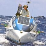 Liz Wardley on her 25-foot row boat, Tic Tac, a few miles outside of Majuro after paddling from Hawaii. She arrived September 1. Photo: Hilary Hosia.