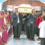Rev. Jori Lokboj’s remains were carried into Uliga Protestant Church Tuesday to start funeral services. Lining the entranceway were students from Marshalls Christian High School — a school that Rev. Jori attended, taught at and was in charge of over his many decades as a pastor in the United Church of Christ. Photo: Hilary Hosia.
