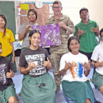 During the US Army’s Oceania Engagement Team visit to Jaluit Atoll, Master Sergeant John Phillips poses with Jaluit High School sewing students (and his pillow case).