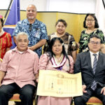 At the ceremony at the Japan Embassy in Majuro on October 10: Laureen Joab Batol, center front, with her husband Joseph and the Japan Ambassador to the Marshall Islands Kazunari Tanaka and his wife Hiromi, and some of Laureen’s family members. Photo: Hilary Hosia.