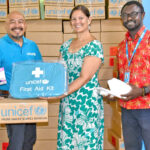 Public School System Commissioner Natalie Nimmer, second from right, with UNICEF officials at a donation ceremony. Photo: Erbiland Mandira.