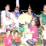 Hundreds of people who descended on the track and field in Jenrok last week for the annual Christmas tree lighting enjoyed posing for photos are the various lighted displays throughout the track area. Photo: Wilmer Joel.