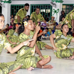 The ladies of the Konaan Jepta perform a sitting dance, while the boys dance around the perimeter at Rita Protestant Church on Christmas Day. Photo: Wilmer Joel.