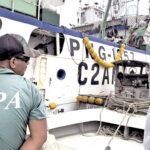 RMI EPA’s David Asiea and Louie Salinas inspect a purse seiner.