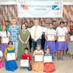 Taiwan Ambassador Steve CC Hsia, President Hilda Heine and Education Minister Gerald Zackios, center standing, joined with many local students who received financial recognition for their top academic achievements in elementary, middle and high school and at the college level. Photo: Chewy Lin.