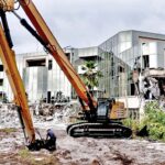 Pacific International Inc.’s huge heavy excavator has been taking aim at the old capital building. Demolition started last week. Photo: Gary Ehrsam.