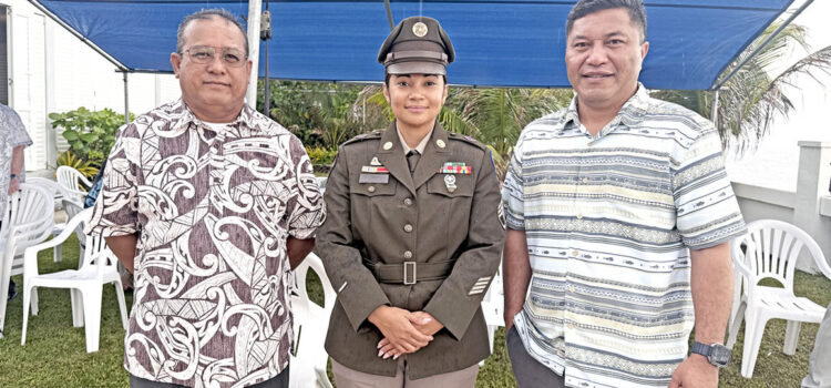 US military veterans Baron Bigler, left, and RMI Foreign Minister Kalani Kaneko, right, joined for a photo with and Army Staff Sgt. Renee Cabral during the ANZAC Day event April 25 in Majuro. Photo: Karen Earnshaw ANZAC Day marked in Majuro