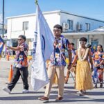 The College of the Marshall Islands honor guard leads the faculty and students into the graduation area. Photo: Goodwind Silk.