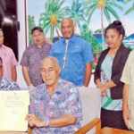 Speaker Brenson Wase was joined by Minister of Culture and Internal Affairs Jess Gasper, Jr. and RMI and Nitijela officials as he displays the confirmation of the approved constitutional amendments. Photo: Darren Lanki