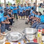 Students at Majuro Baptist Christian Academy in Rita gather around the makeshift kitchen at the school to participate in and eat the results from “harvest cooking” — which means cooking produce harvested from gardens. Photo: Wellness Center.