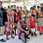 At the Lib Island handover, the community gathered for a program. At left, front, is Lib Mayor Winlan Sheet, and Japan Deputy Chief of Mission Takashi Hattori is at center with Marshallese lei on.