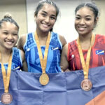 Gold medalist wrestler Zyra Neimana, center, was called to honor as the “Most Outstanding Junior Female Athlete of the 12th Pacific Mini-Games.” She is pictured with other RMI wrestlers: Serina Nunes, left, and Sydel Ajen.