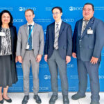 At the Paris OECD meetings, from left: Meredith Kirby, Ann Marie S. Muller, OECD Global Forum Secretariat’s Mark Scott, Hirotaka Katou, James Myazoe, and Ryan Gibson.