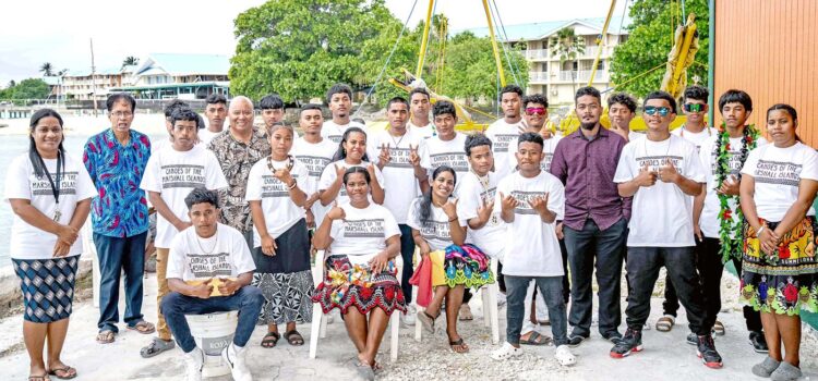 Waan Aelon in Majel graduates pose after the graduation with Director Alson Kelen,sixth from left standing, Deputy Director Sealend Laiden, sixth from right, and WAM board member Kanchi Hosia, second from left standing. Photo: Chewy Lin. Unique graduation at WAM