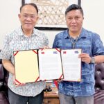 Taiwan Chargé d’Affaires Hank Liu, left, presented a check for $7,240,455 to Foreign Minister Kalani Kaneko on August 22.