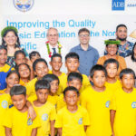 elap Elementary School students with VIPs attending the opening of the new learning resource center on the DES campus. Photo: Chewy Lin.