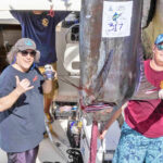 Team Australia Captain Lachlan Sommerville, right, with teammate Chris Yanckello and the winning 317 pound marlin. Photo: Marshalls Billfish Club.