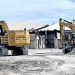 Pacific International Inc. mobilized heavy equipment to the Nitijela complex Monday this week to begin demolishing the burned out structure of the parliament building. Photo: Giff Johnson.