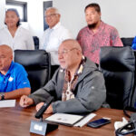 Signing off on the grant for Arno Atoll Local Government for marine conservation work, front: Pacific Islands Tuna General Manager Gene Muller and Natural Resources and Commerce Minister Tony Muller. Standing, from left: MIMRA Protected Area Network Coordinator Alicia Edwards, The Nature Conservancy’s RMI Program Manager Chloe Abraham, Education Minister and Arno Nitijela Member Gerald Zackios, Arno Mayor Baji Danny and his wife Resslyn.