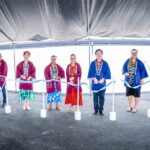 Marshall Islands President Hilda Heine, center, red jacket, and Japan Ambassador Hirohisa Soma, to the President’s left in blue jacket, headed a lineup of VIPs to cut the ribbon officially opening the new water reservoir. Photo: Chewy Lin.
