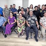 VIPs joined Immigration and Passport office staff inside their new office next to ELM Motors at Monday’s opening. Photo: Giff Johnson.