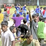 Team Namo fans went wild running onto the field to celebrate after Namo’s comeback victory Monday night in the championship game against Team Lae in the Ralik Ratak Softball Tournament. Photo: Wilmer Joel.