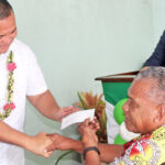Bonjo Ned received the first Enra check from Finance Minister David Paul and MISSA Administrator Bryan Edejer. MISSA is managing the Enra quarterly distribution. Photo: Rubon JR Jacklick.