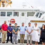 Marshall Islands Foreign Minister Kalani Kaneko, fifth from right, and US Ambassador Laura Stone, to his left, signed an enhanced Shiprider Agreement and then posted with US and RMI law enforcement officials next to the Coast Guard Cutter Frederick Hatch.