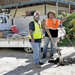 A Public Works road repair crew was spotted in Uliga early Monday morning. Kevin deBrum, giving the Journal photographer a thumbs up, together with Win Jetton. Photo: Giff Johnson.