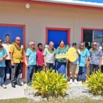Education Minister Gerald Zackios, sixth from left, joined with Public School System officials, Northern Islands High School teachers and administrators, and donors for the opening of the new cafeteria. Photo: Public School System.