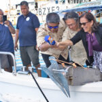 At the dedication event for the new Japan-provided boats, from left: Irooj Farrend Zackious, Japan Ambassador Hirohisa Soma and President Hilda Heine christen the newly arrived MIMRA vessels MV Bokak and MV Bikar during a ceremony last Friday at the dock by MIMRA HQ. Photo: Rubon JR Jacklick.