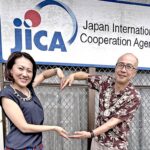 New Japan International Cooperation Agency volunteers Sachiko Kutsuma and Yasuhiro Fukuda outside the JICA office in Majuro. Photo: Giff Johnson.