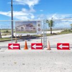 The airport parking lot has been cordoned off to allow for construction of a new domestic terminal. Photo: Giff Johnson.