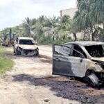 The two destroyed vehicles sit across from the MEC fuel tank facility after they burned late Friday night a few seconds after driving through MEC diesel on the main road. Photo: Brett Schellhase.